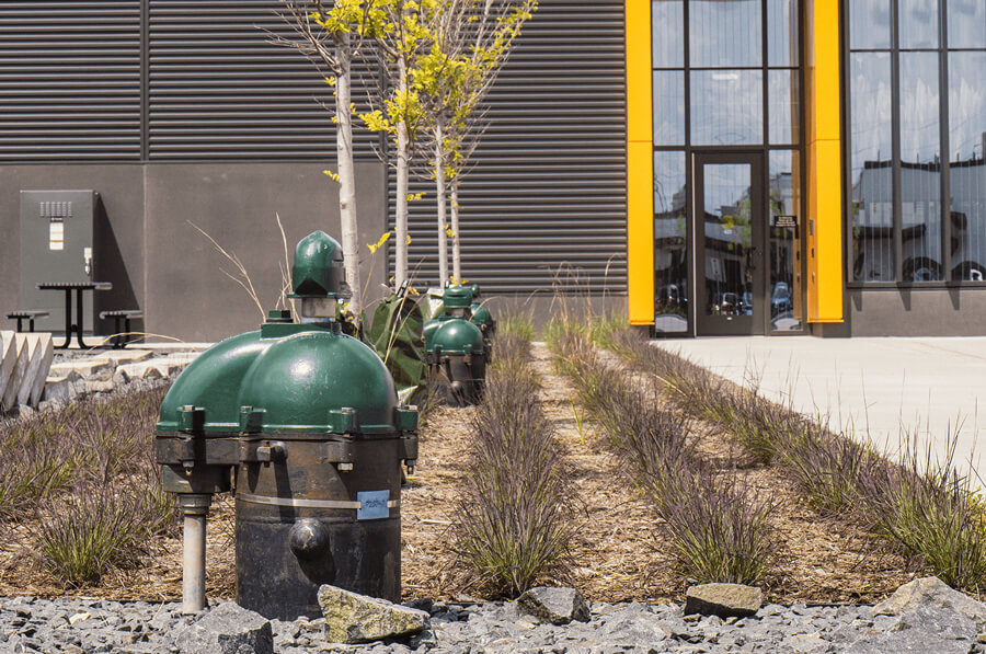 Front entrance to U of M building with Darcy Geothermal Well heads visible